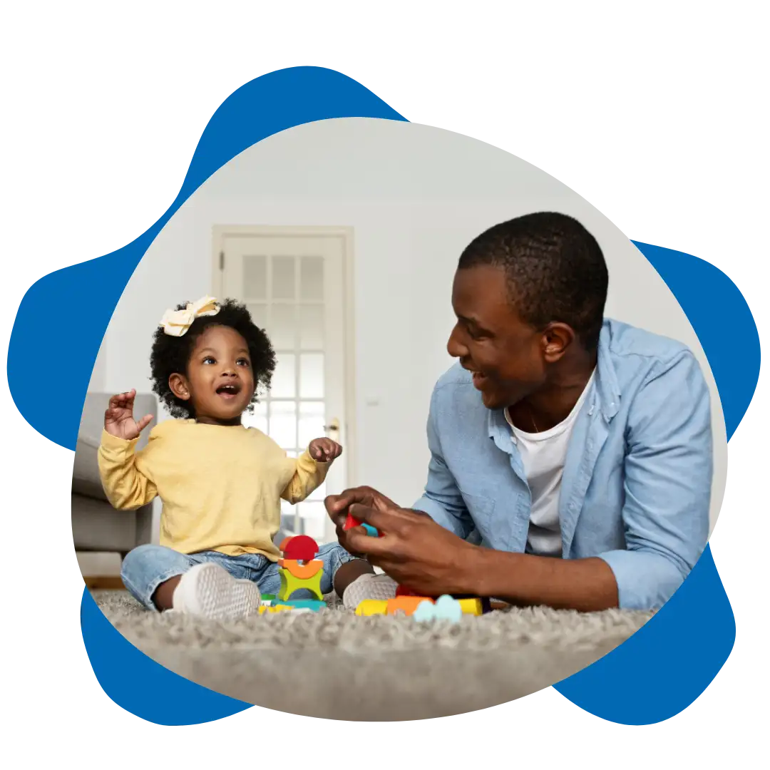 Relieved Parent Father smiling at his child at home supporting autism development